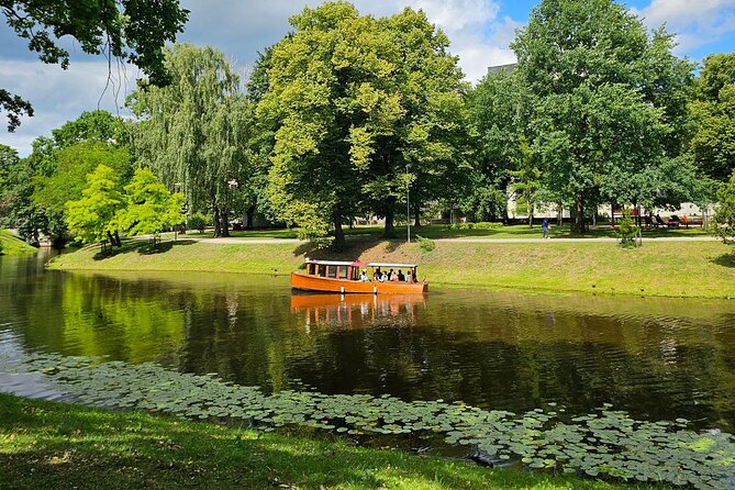 Riga Canal and Daugava Boat Tour with Welcome Drink & Audio Guide - Key highlights worth your time
