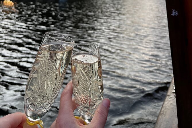Riga: Evening or Sunset Boat Tour with Drink and Audio Guide - Sunset versus night: when you should choose each departure time