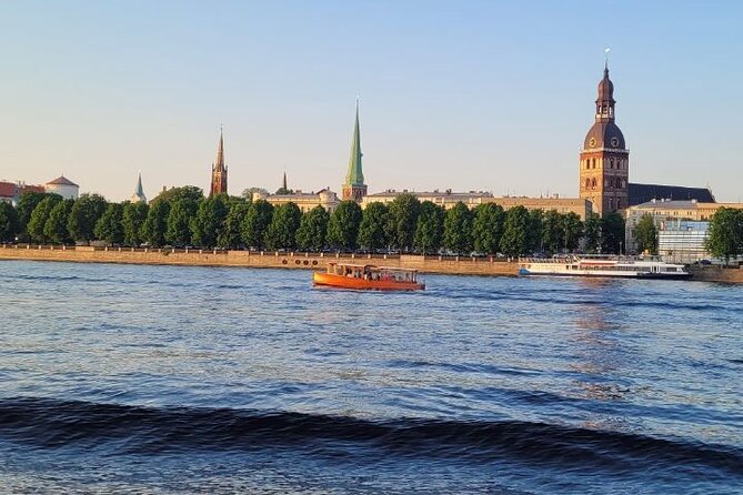 Riga: Evening or Sunset Boat Tour with Drink and Audio Guide - Drink and audio guide: the included perks that affect your comfort