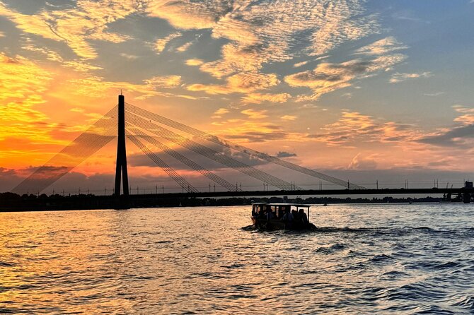 Riga: Evening or Sunset Boat Tour with Drink and Audio Guide - Price and value: what $13.88 buys you for 50 minutes in Riga