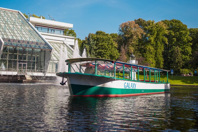 Riga Sightseeing Tour by Canal Boat with Audioguide - Kipsala Wooden House District and Vansu Bridge Stories
